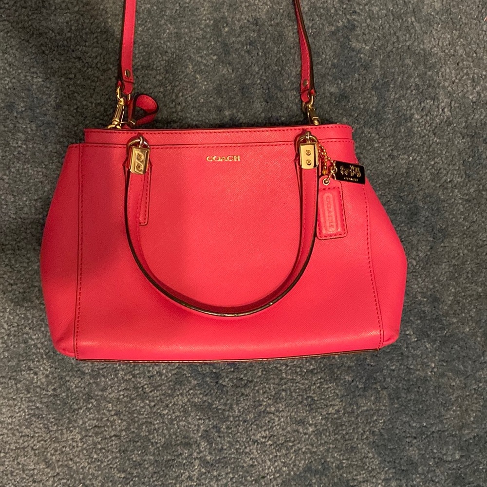 Coach purse. Pink exterior. Tan interior.